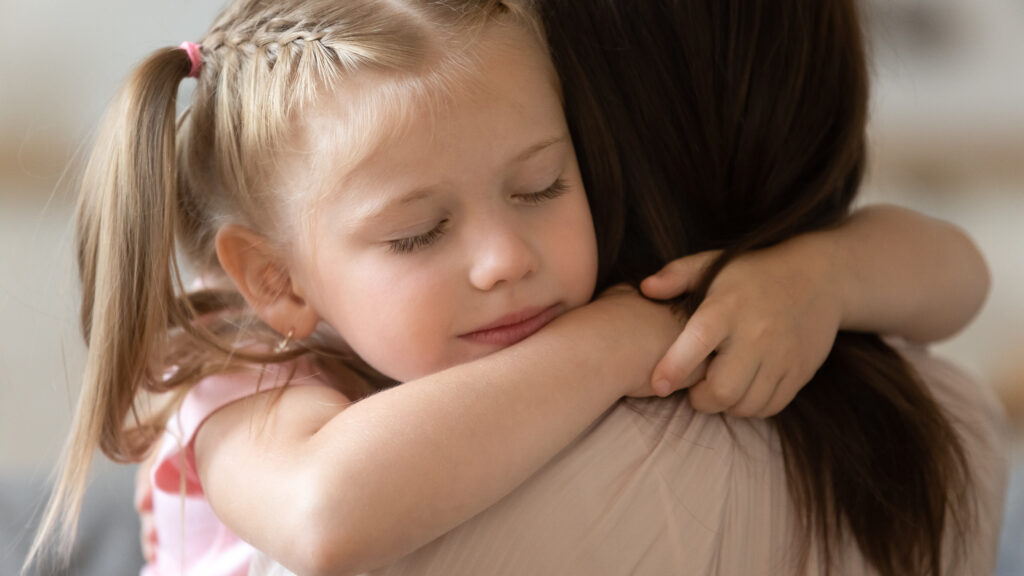 Child hugging woman